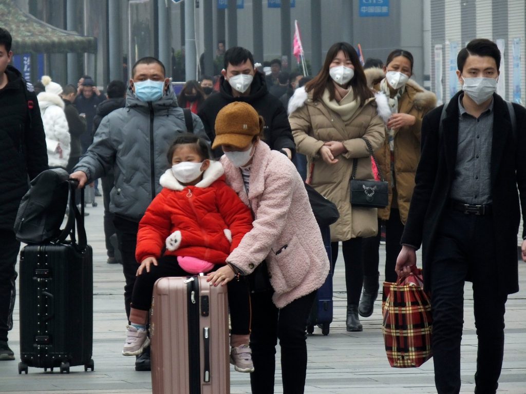 travelers wearing masks
