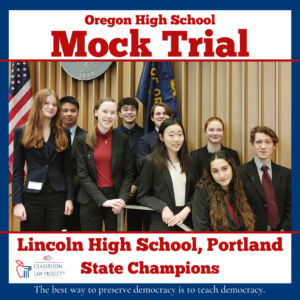 A group of students stand in front of the U.S. and Oregon flags before competing in the final round of the Oregon High School Mock Trial State Competition